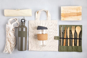 Zero waste kit containing reusable food water bottle, silverware, and carrying case.