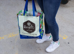 Reusable grocery bag with "Recycle, MI" logo on it.