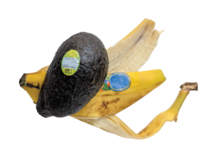 Avocado skin and banana peel, each with a produce sticker on them