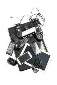 Stack of mixed old and broken electronics including laptop, cell phones, cords, computer mouses, and tablets.