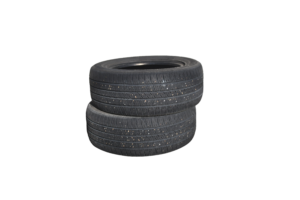 A stack of 2 black car tires