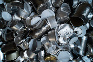 A large amount of clean metal containers prepared for recycling.