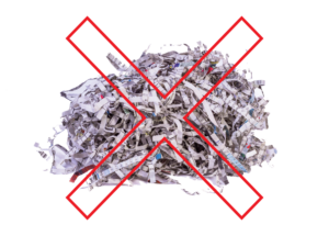 Small pile of shredded office paper with a red X overlayed on top